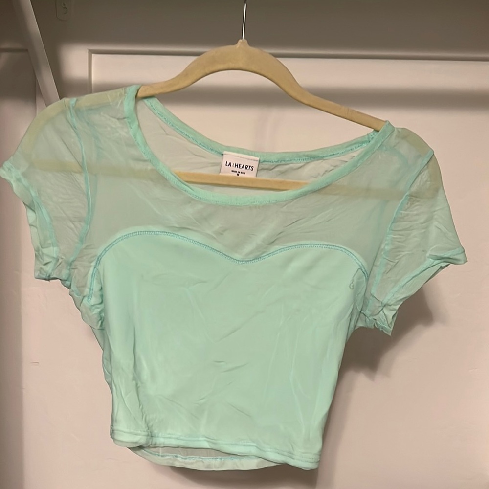 Crop top that is see through in the back.